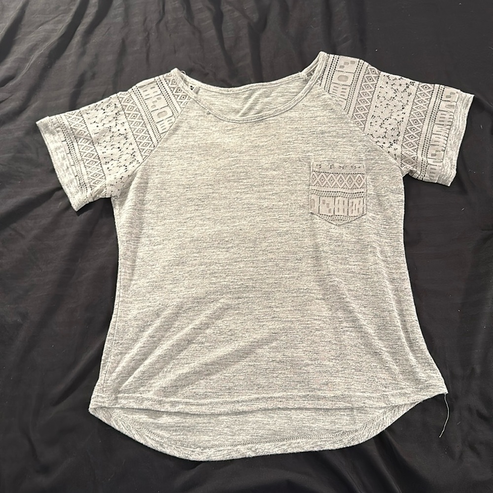 Simple basic shirt with lace sleeve and pocket.